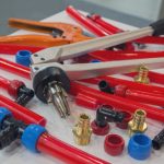 Water,Pipes,Pex,And,Mounting,Tools,On,The,Table.,Plumbing